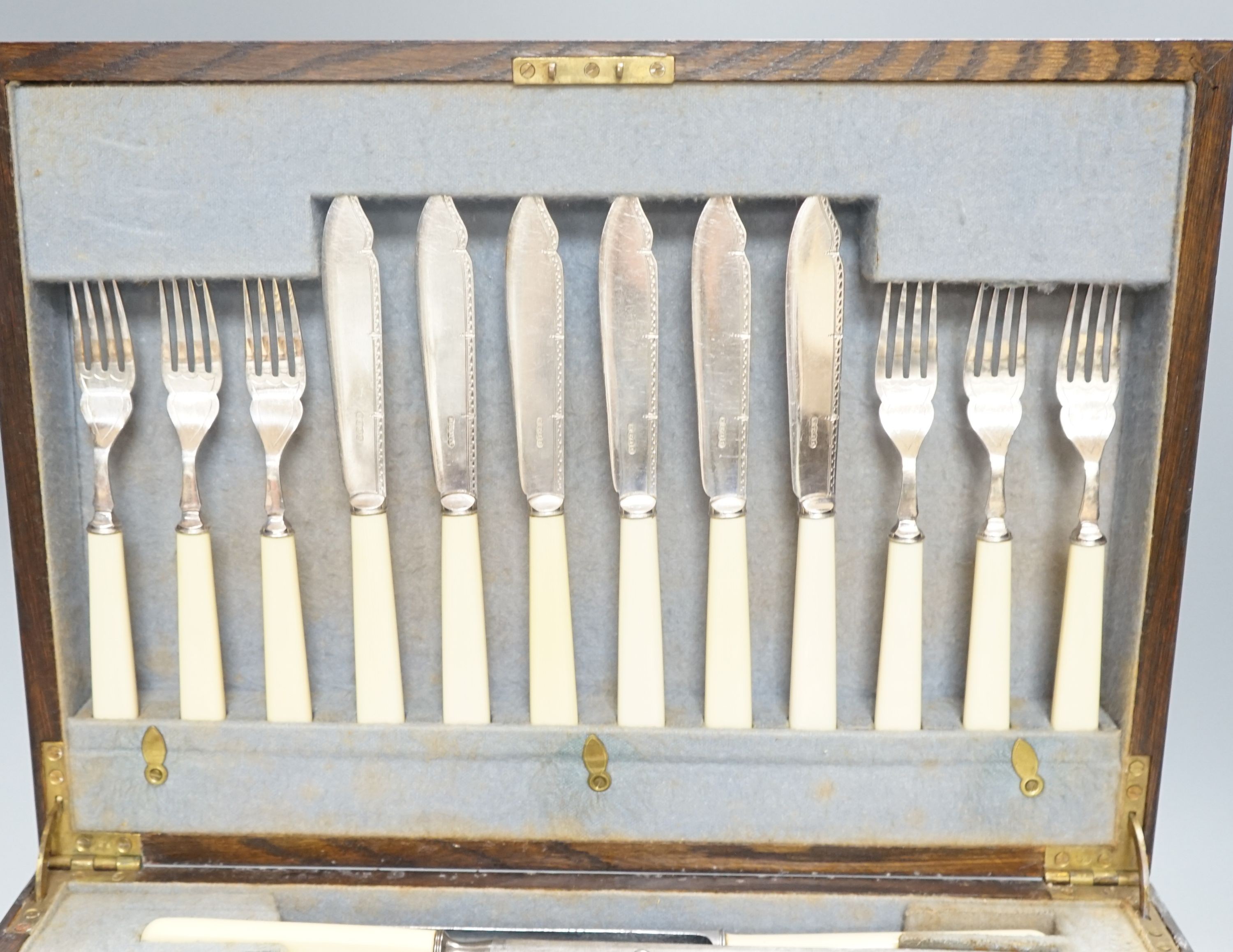 An oak cased canteen of plated cutlery and other flatware